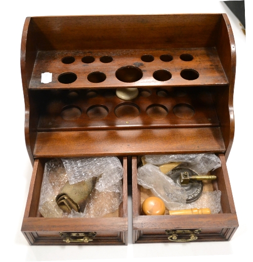 Laboratory Cabinet with eleven spaces for test tube storage and two draws below