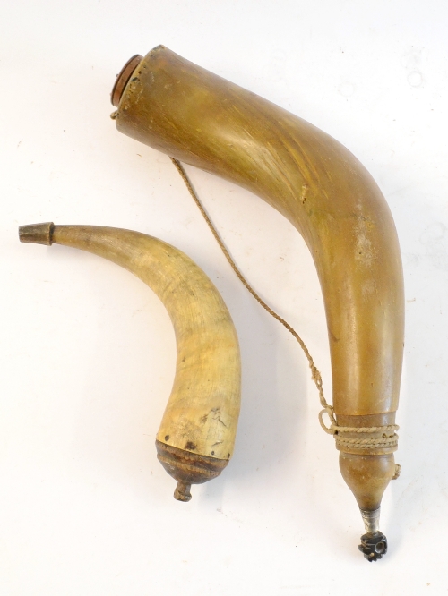 A 19th Century Continental Large Powder Horn, with turned wood base, the dark horn stopper carved