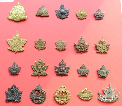 A Collection of Twenty First World War Canadian Cap and Collar Badges, to the 23rd Infantry (