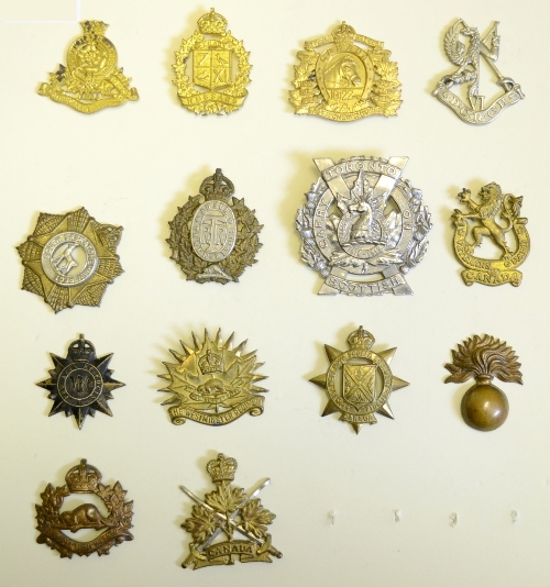 A Collection of Fourteen Second World War Canadian Cap Badges, in brass, bronze, bi-metal and white