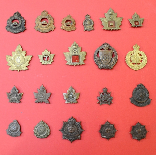 A Collection of Twenty One First World War Canadian Cap and Collar Badges, to the 1st Overseas