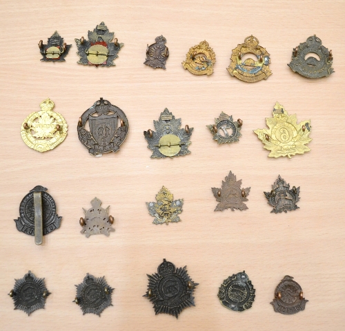 A Collection of Twenty One First World War Canadian Cap and Collar Badges, to the 1st Overseas - Image 2 of 2