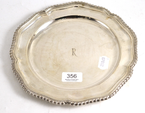 A silver dinner plate, initialled R, gadrooned edge, London hallmark 19.3ozt