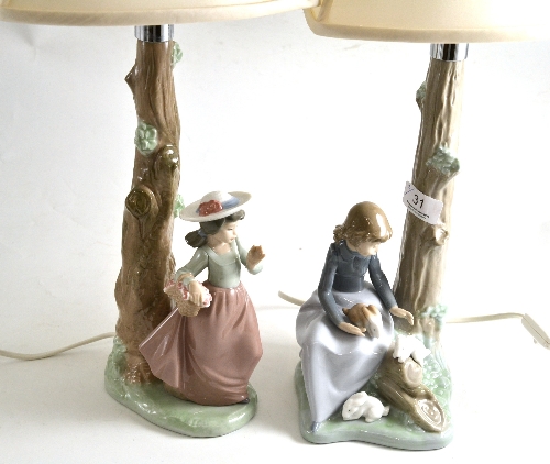 A pair of Nao figural table lamps