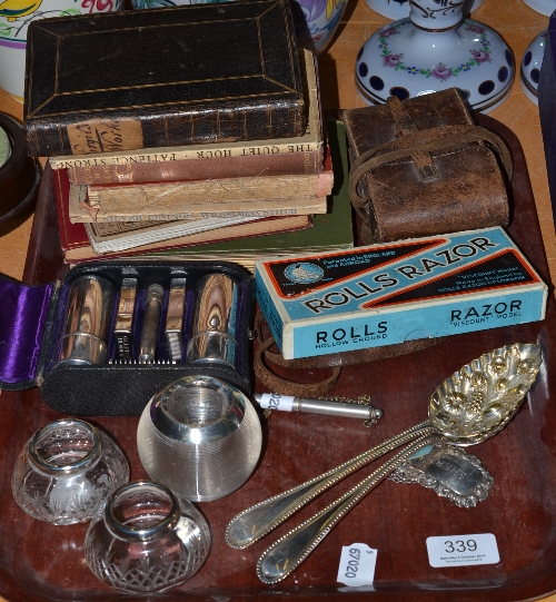 An Acme dog whistle, a glass match striker, silver sherry label, camera, books etc