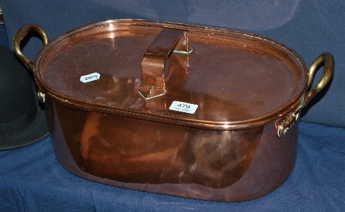 An oval copper fish kettle