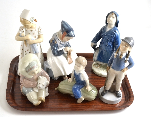 Five Royal Copenhagen and B&G figures and a Lladro figure (6) All figures in good condition, no