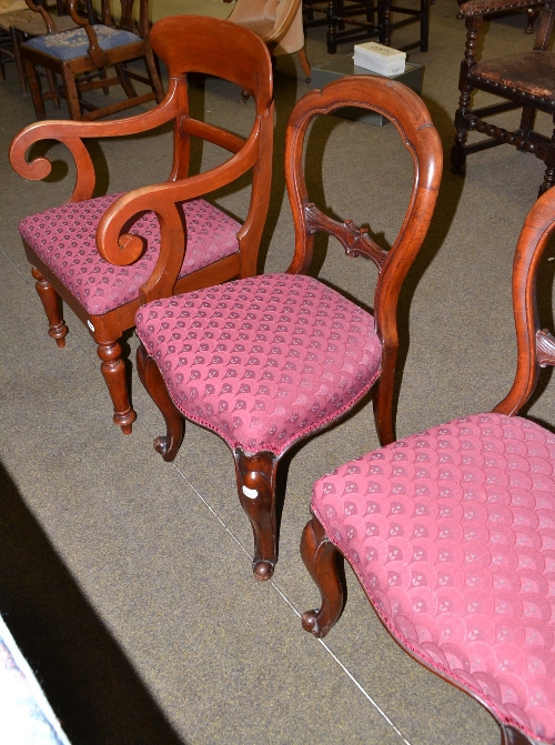 Four Victorian mahogany balloon back dining chairs and two mahogany carver chairs