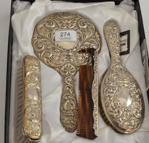 Four piece silver mounted brush set