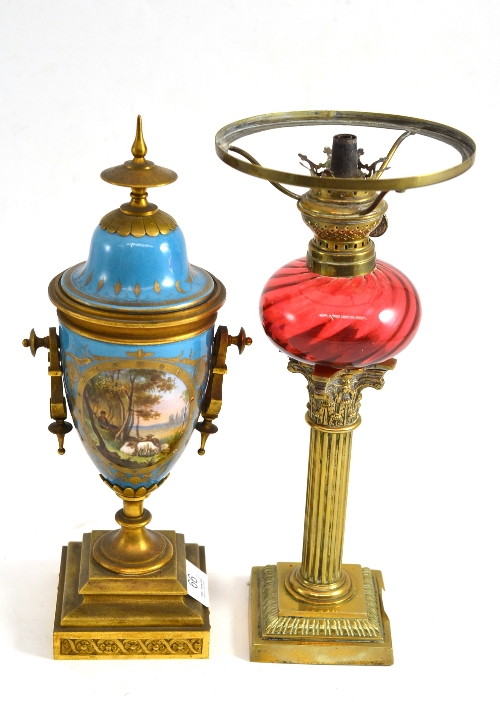 A Continental porcelain ormolu mounted porcelain vase and cover and an oil lamp with Corinthian