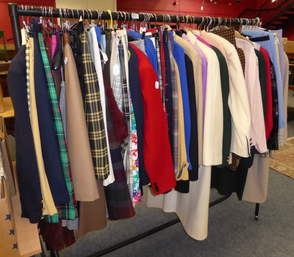 A large quantity of modern clothing including wool coats, checked skirt and separates including
