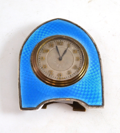 A silver and enamel strut clock