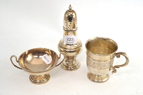 Three pieces of Edwardian silver, comprising Celtic design mug, large sugar caster and a two