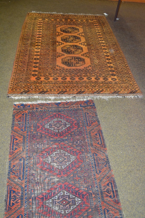 An Afghan Turkmen rug, the gold field with four quartered guls enclosed by multiple borders, 200 by