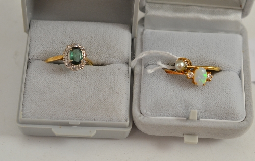 An 18ct gold opal and diamond three stone ring and two other stone set rings (3)