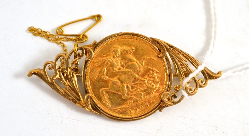 A 1908 full sovereign in a 9ct gold brooch mount