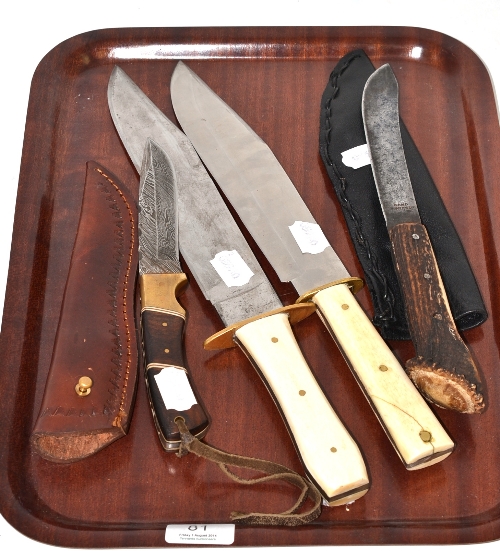 A knife with antler handle and leather sheath, a Bowie knife with damascened blade and two Bowie