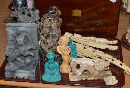 A tray of Oriental items including soapstone vases, bookends, an African elephant bridge etc