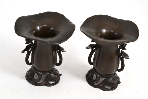 A pair of Japanese bronze vases modelled as turtles supporting a lotus flower