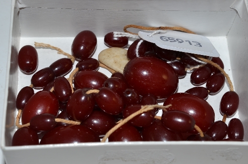 A quantity of cherry amber beads - to be strung as a necklace