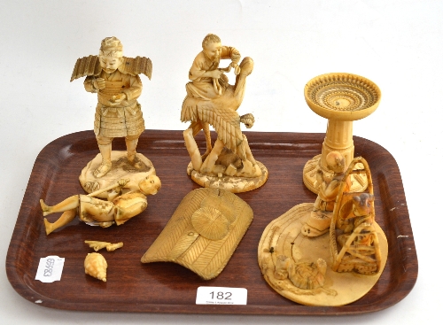 Three ivory figures and a stand