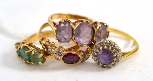 Four gem set gold rings