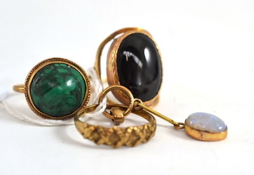 An opal pendant, a malachite ring, a star ring and another ring