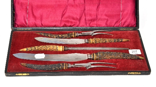 A carving set in fitted case with horn handles and Dickinson of Sheffield blades