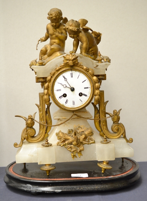 A French alabaster mantel clock with gilt metal mounts