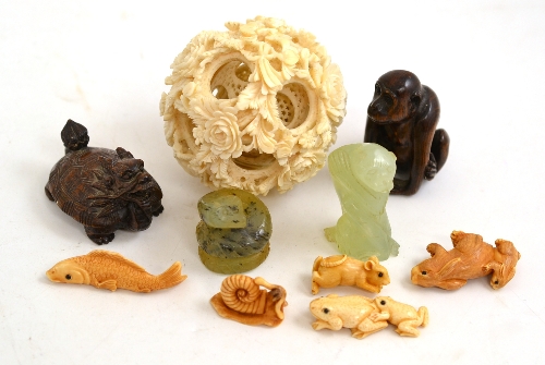 A Chinese puzzle ball, eight various netsukes, a jade monkey etc