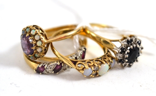 Five 9ct gold stone set rings