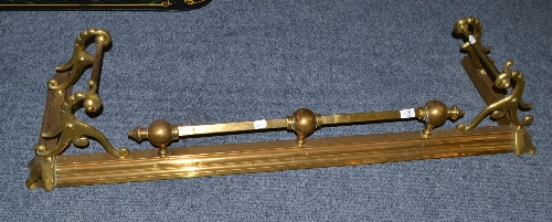 A Victorian brass fender