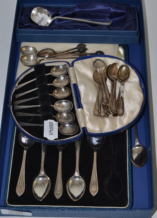 Two cased sets of silver coffee spoons, a boxed silver ladle and two sets of silver coffee spoons