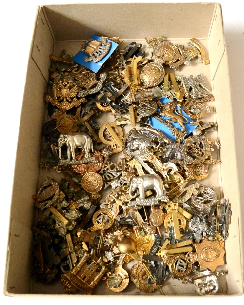 A Collection of One Hundred and Seventeen British Military Cap Badges, in brass, white metal, bi-