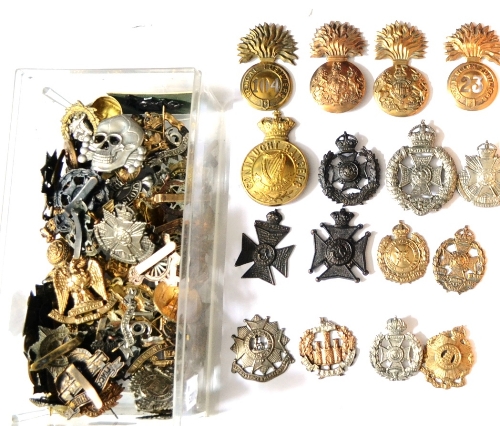 A Collection of Seventy Six British Military Cap and Glengarry Badges, in brass, white metal, bi-