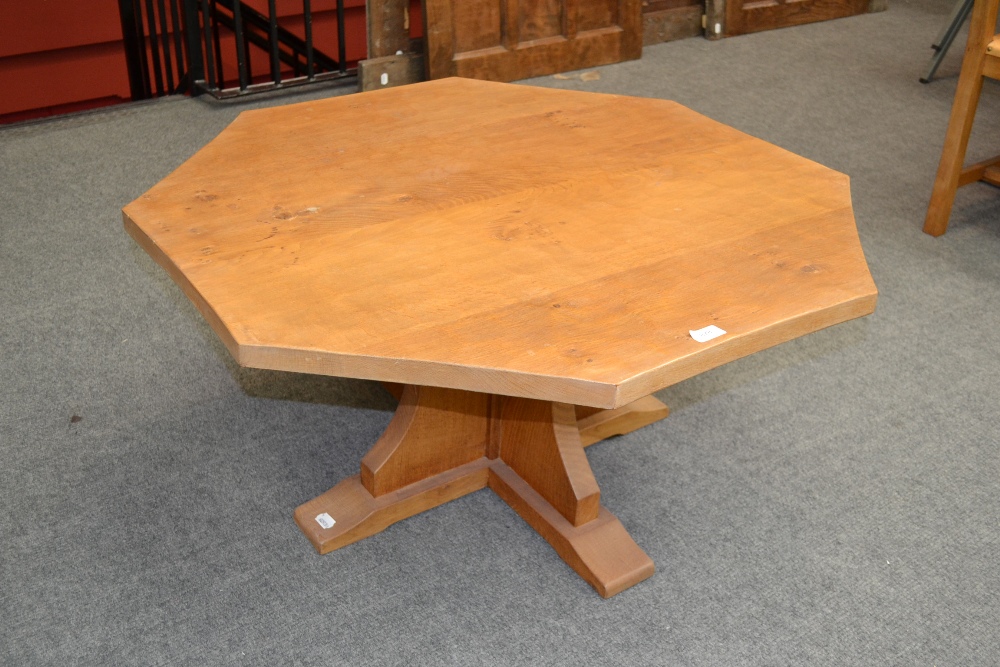 A Derek ``Lizardman`` Slater Oak Octagonal Coffee Table, on a cruciform base, with carved lizard