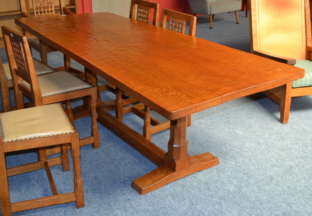 A Peter ``Rabbitman`` Heap Oak 7` Three Plank Dowelled Top Refectory Table, on two octagonal legs