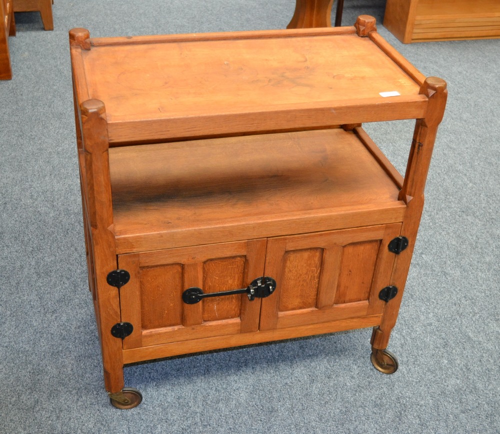 A Yorkshire School Oak Tea Trolley, the rectangular top above an undertier, above two cupboard