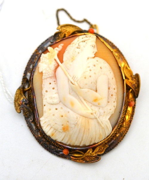 A Victorian cameo brooch, the oval shell carved to depict a goddess, within an ornate frame