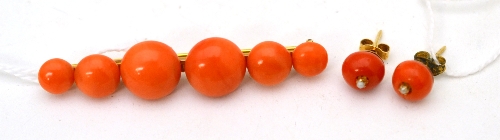 A Victorian coral bar brooch, six beads of graduated size, length 6cm and a pair of coral and pearl