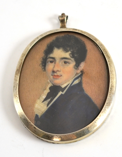 English School, late 18th century, portrait of a young man, bust length, wearing a blue coat,