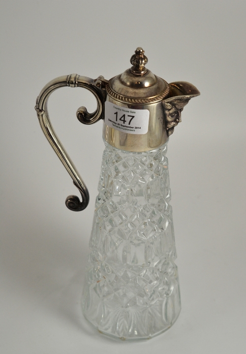 A silver plated and moulded glass claret jug, 28.5cm high