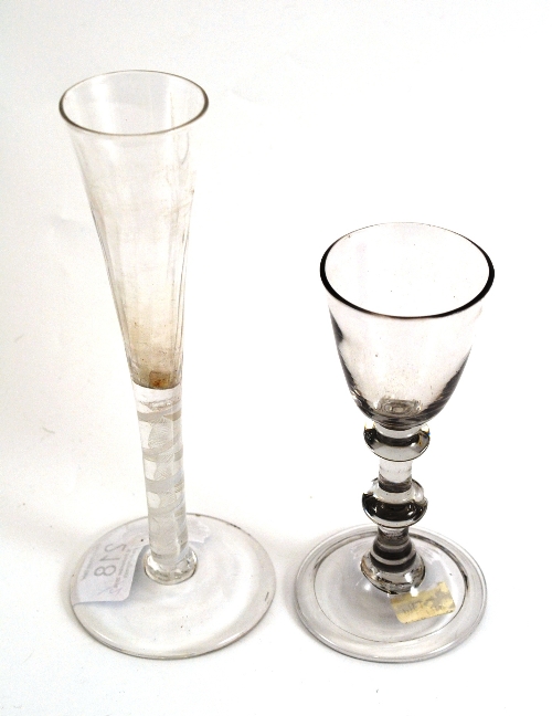 An 18th century cordial glass with conical bowl and latticino stem; an 18th century cordial glass