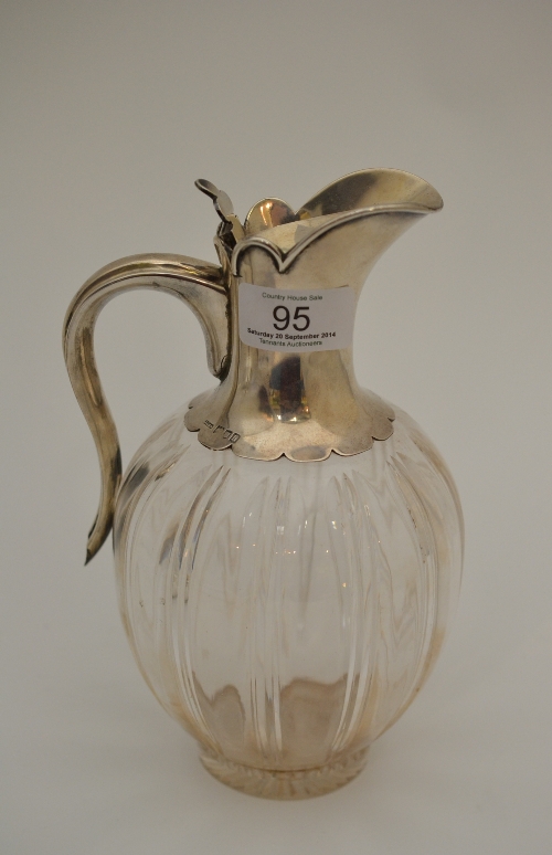 An Edwardian silver mounted claret jug, John Grinsell & Sons, London 1903, the ovoid body with