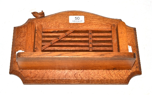 A Bob `Wrenman` Hunter oak letter rack