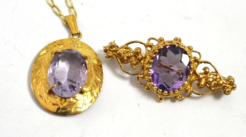 An amethyst pendant on chain and an amethyst brooch