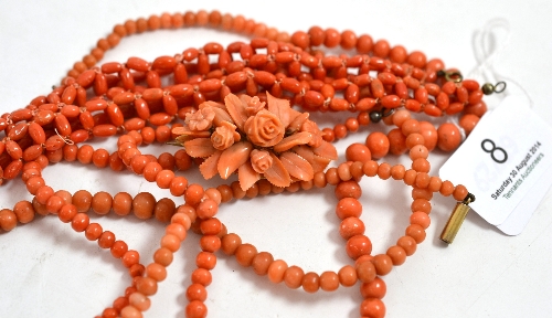 A rose carved coral brooch, two coral necklaces and two bracelets