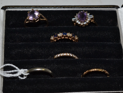 An 18ct white gold band, a band ring and four 9ct gold stone set dress rings (set with amethysts,