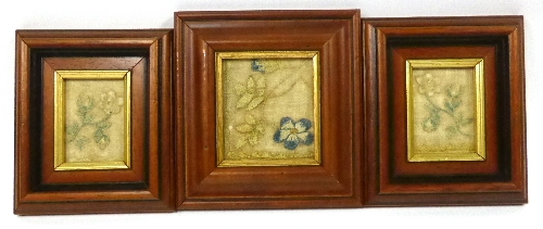 Three Early 19th Century Embroidered Fragments depicting flowers, in modern frames, 15cm x 18cm and