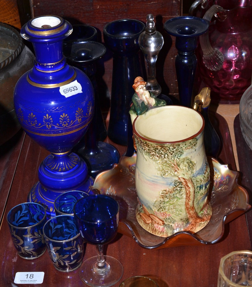 A tray of blue glass, lamp base, carnival glass bowl and a musical mug
